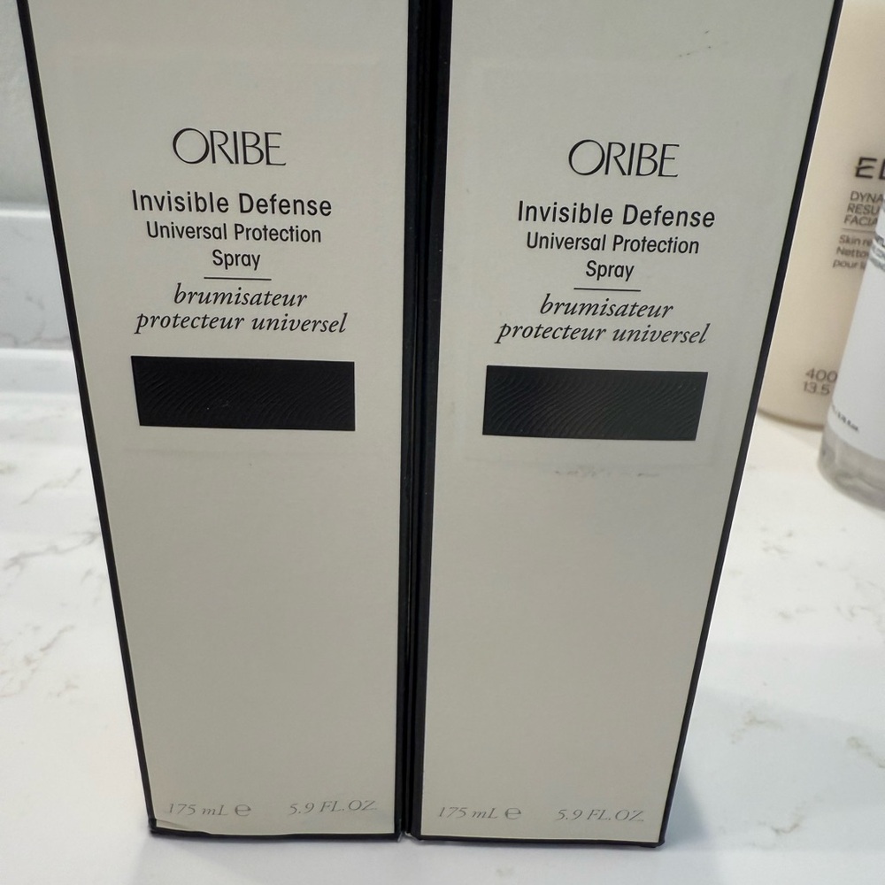 Oribe Invisible Defense Spray with Black and Cream Design